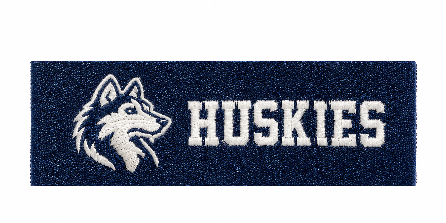 Navy Huskies woven label with folded side edges