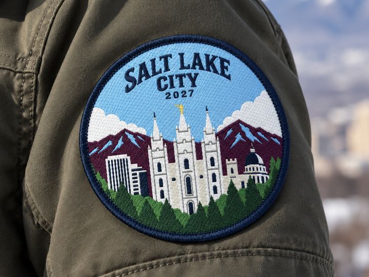 Salt Lake City 2027 woven patch on a green jacket sleeve